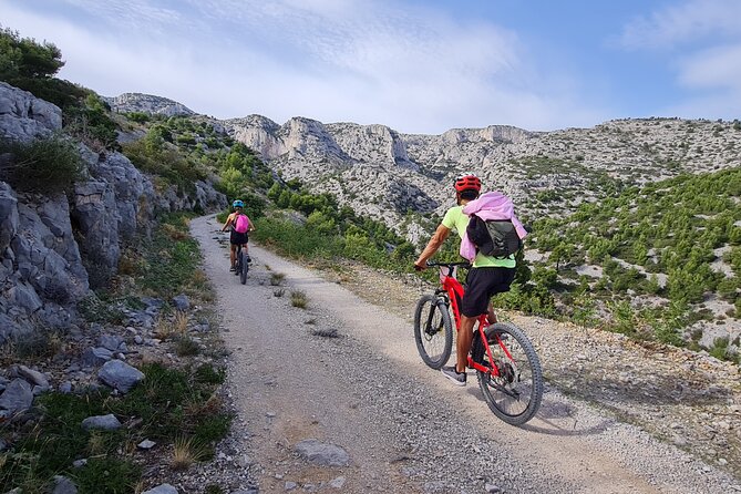Cassis: Three Calanques Tour by Electric Mountain Bike - Riding through Cassis: Proveçal village streets from the saddle