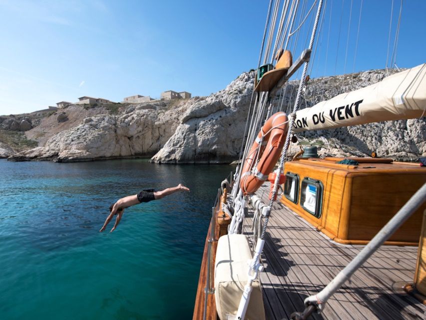 Marseille: Calanques Sailing Day Trip with Lunch and Wine - Meeting Le Don du Vent in Marseille: Pier #2 and a historic feel