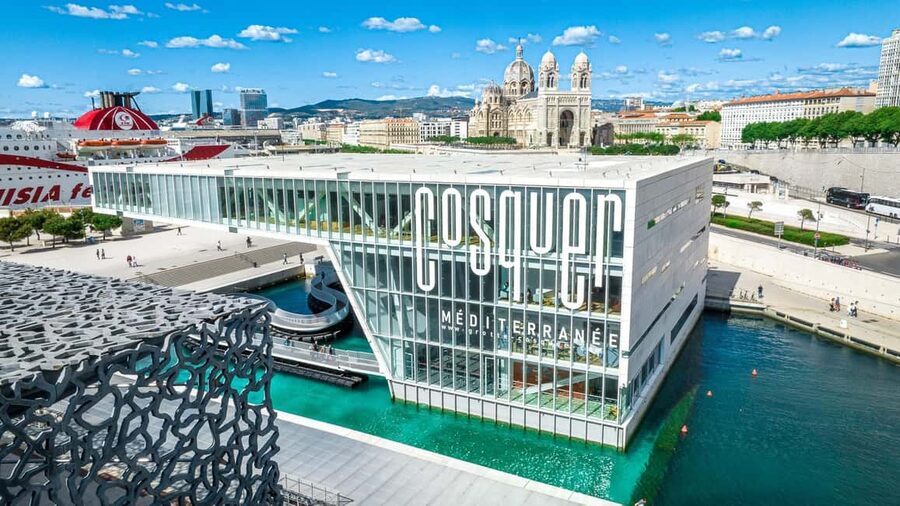 Marseille: Cosquer Cave Ticket & Panier District Audio Tour - Start at Promenade Robert Laffont: walking to the cave above the water